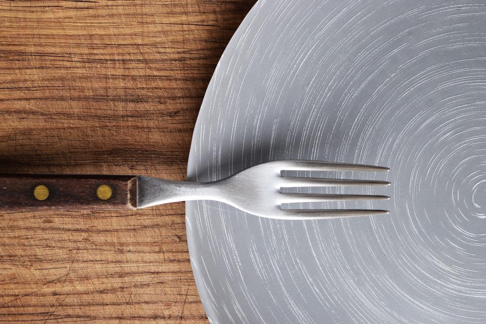 Fork on an empty plate