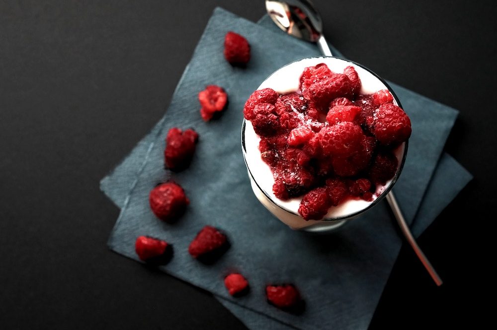 Yogurt and fresh raspberries - full of probiotics