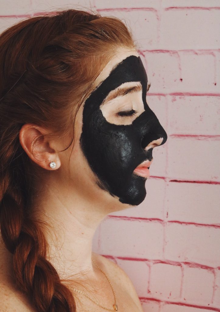 Woman wearing activated charcoal mask 
