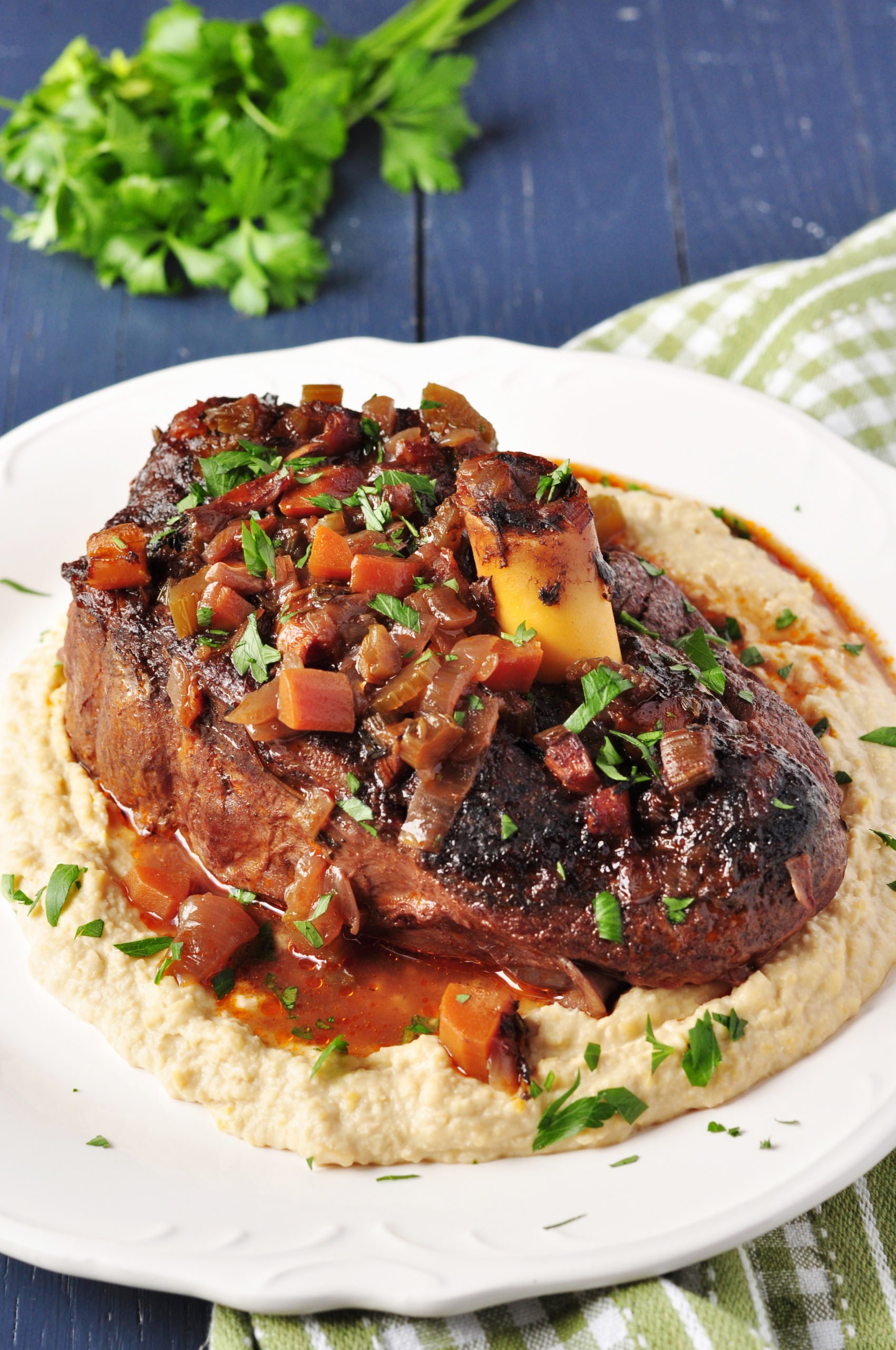 These slow-cooked, fall-off-the-bone-tender braised lamb shanks are perfectly paired with a savory red wine sauce. Just 15 minutes of prep and 8 easy steps.