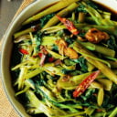 Stir-fried water spinach (also known as morning glory) is a healthy, hearty Thai vegetable dish that’s bursting with flavor and nutrients. Ready in 15 minutes.