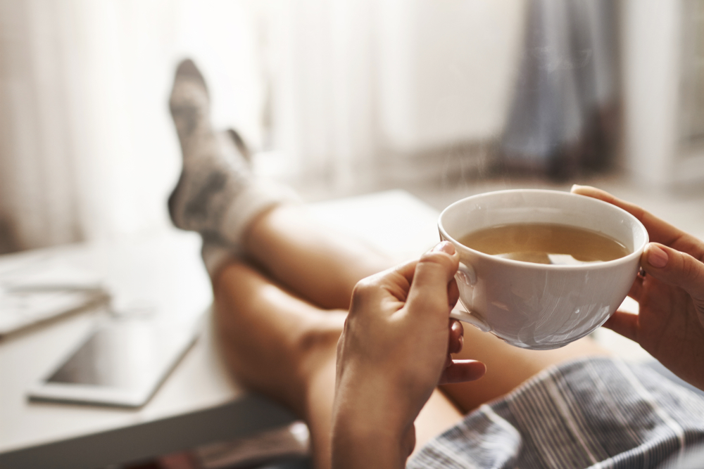 relaxing on couch sipping tea bone broth